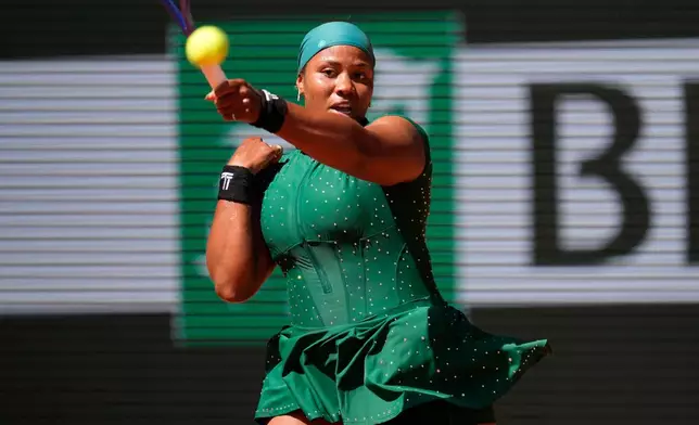 Taylor Townsend of the U.S. returns to Coco Gauff of the U.S. during their first round women's singles tennis match at the French Open tennis tournament in Paris, Tuesday, May 26, 2026. (AP Photo/Christophe Ena)