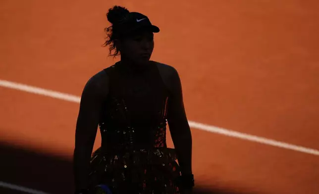 Naomi Osaka of Japan reacts as she plays against Laura Siegemund of Germany during their first round women's singles tennis match at the French Open tennis tournament in Paris, Tuesday, May 26, 2026. (AP Photo/Aurelien Morissard)