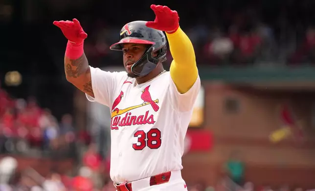 St. Louis Cardinals' Nelson Velazquez celebrates after hitting a single during the eighth inning of a baseball game against Cincinnati Reds Sunday, June 7, 2026, in St. Louis. (AP Photo/Jeff Roberson)