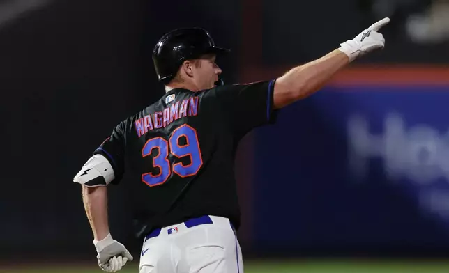New York Mets first baseman Eric Wagaman (39) gestures after hitting a two-run home run during the sixth inning of a baseball game against the Chicago Cubs, Thursday, June 25, 2026, in New York. (AP Photo/Heather Khalifa)