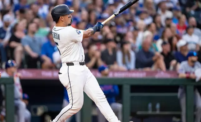 Seattle Mariners' Jhonny Pereda hits a three-run home run during the fifth inning of a baseball game against the New York Mets, Tuesday, June 2, 2026, in Seattle. (AP Photo/Stephen Brashear)