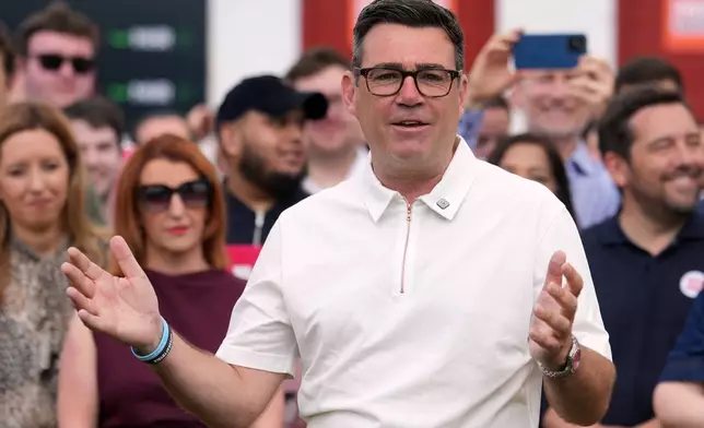 Britain's Labour party candidate Andy Burnham speaks to supporters after the Makerfield by-election in Ashton in Makerfield, England, Friday, June 19, 2026.(AP Photo/Jon Super)