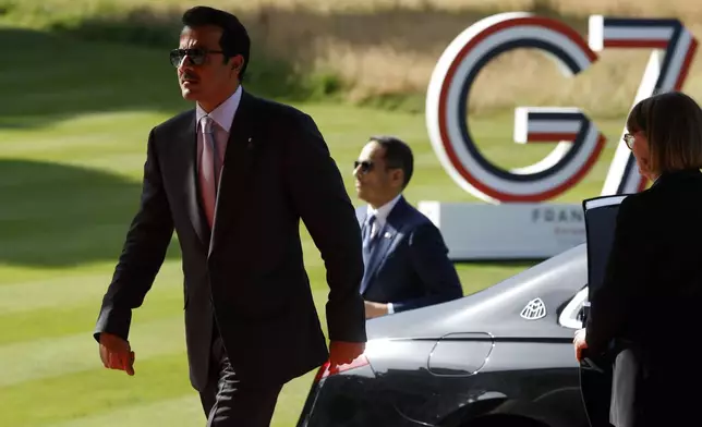 Qatar's Emir Sheikh Tamim bin Hamad Al Thani arrives at the Hotel Royal for a G7 Summit in Evian-les-Bains, France, Tuesday, June 16, 2026. (Yoan Valat/Pool Photo via AP)