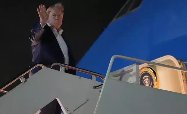 President Donald Trump waves as he boards Air Force One, Monday, June 15, 2026, at Joint Base Andrews, Md. (AP Photo/Julia Demaree Nikhinson)