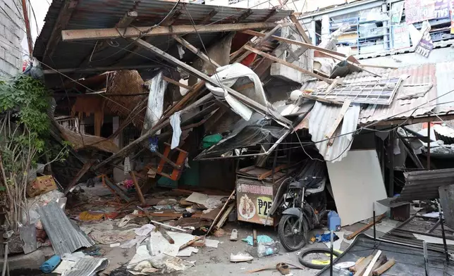 Damaged houses are seen following an earthquake in General Santos, Philippines Tuesday, June 9, 2026. (AP Photo/Basilio Sepe)
