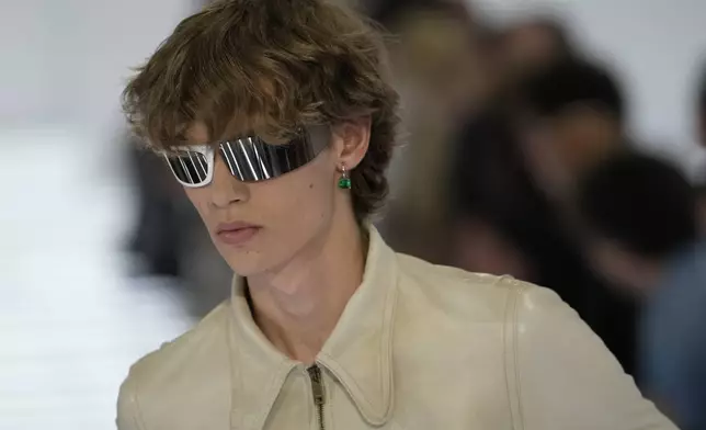 A model wears a creation from Prada's Spring/Summer 2027 men's collection presented in Milan, Italy, Sunday, June 21, 2026. (AP Photo/Luca Bruno)