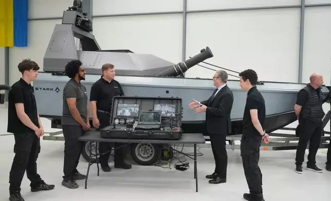 Britain's Prime Minister Keir Starmer looks at a Vanta system as he visits STARK, a leading defence tech company in Swindon, England, Friday, June 5, 2026. (AP Photo/Alastair Grant, Pool)