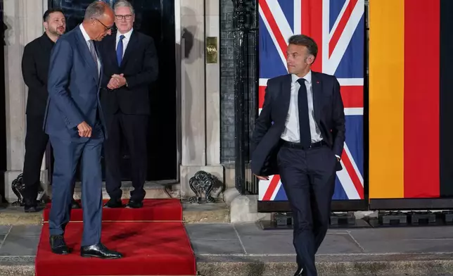 Britain's Prime Minister Keir Starmer, third from left, stands with Ukraine's President Volodymyr Zelenskyy, far left, as France's President Emmanuel Macron, right, and Germany's Chancellor Friedrich Merz leave 10 Downing Street after their meeting in London, Sunday, June 7, 2026. (AP Photo/Alberto Pezzali)