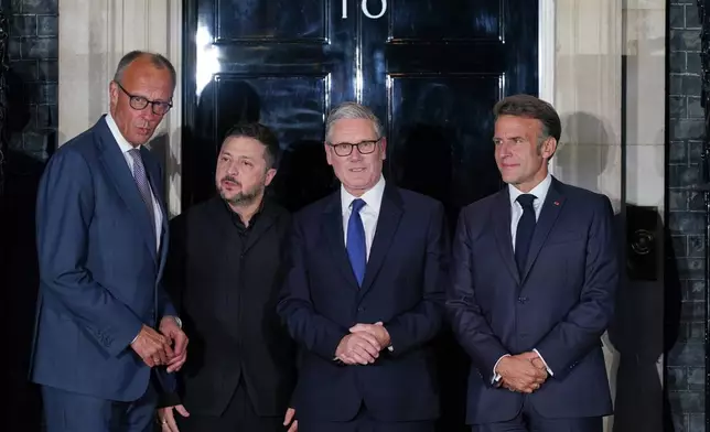 Britain's Prime Minister Keir Starmer, second from right, France's President Emmanuel Macron, right, Ukraine's President Volodymyr Zelenskyy, second from left, and Germany's Chancellor Friedrich Merz pose on the doorstep of 10 Downing Street after their meeting in London, Sunday, June 7, 2026. (AP Photo/Alberto Pezzali)