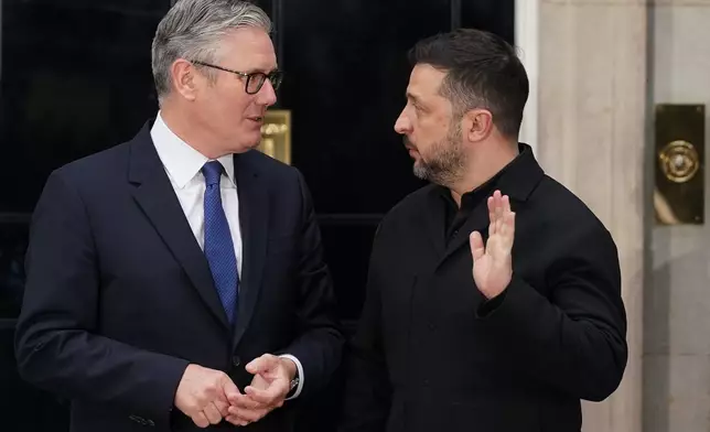 Britain's Prime Minister, Keir Starmer, left, greets the President of Ukraine, Volodymyr Zelenskyy on the doorstep of 10 Downing Street ahead of a meeting inside, in London, Sunday, June 7, 2026. (AP Photo/Alberto Pezzali)