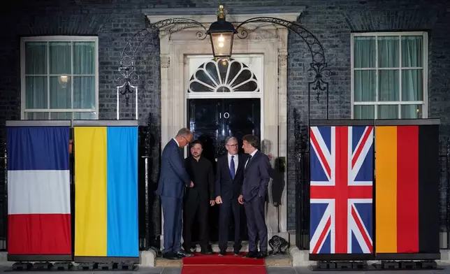 Britain's Prime Minister Keir Starmer, second from right, stands with France's President Emmanuel Macron, right, Ukraine's President Volodymyr Zelenskyy, second from left, and Germany's Chancellor Friedrich Merz, on the doorstep of 10 Downing Street after their meeting in, London, Sunday, June 7, 2026. (AP Photo/Alberto Pezzali)