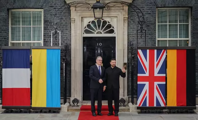 Britain's Prime Minister, Keir Starmer, left, greets the President of Ukraine, Volodymyr Zelenskyy on the doorstep of 10 Downing Street ahead of a meeting inside, in London, Sunday, June 7, 2026. (AP Photo/Alberto Pezzali)