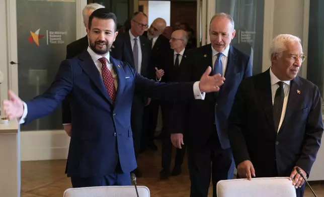 Montenegro's President Jakov Milatovic, left, and European Council President Antonio Costa, right, attend the EU-Western Balkans summit in the Montenegrin coastal town of Tivat, Friday, June 5, 2026. (AP Photo/Risto Bozovic)