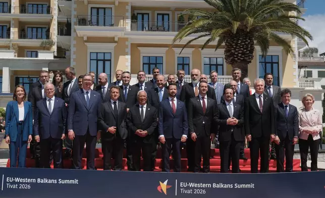 EU leaders and officials from the candidate countries pose for the family photo of the EU-Western Balkans summit in the Montenegrin coastal town of Tivat, Friday, June 5, 2026. (AP Photo/Risto Bozovic)