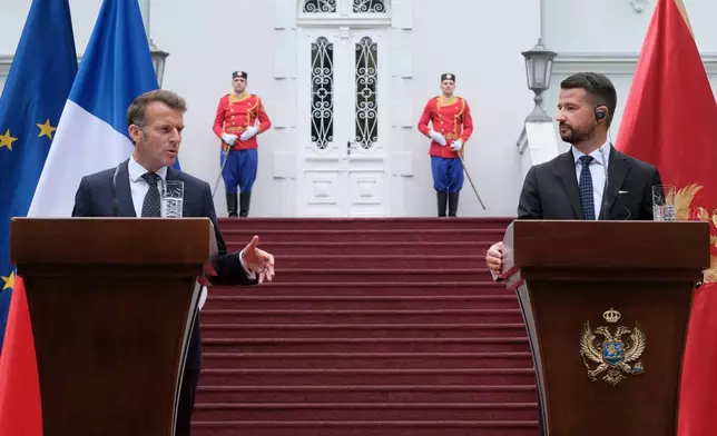French President Emmanuel Macron, left, speaks during a press conference after talks with Montenegro's President Jakov Milatovic, right, in Cetinje, Montenegro, Thursday, June 4, 2026. (AP Photo/Risto Bozovic)