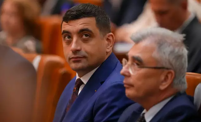George Simion, leader of the opposition right wing AUR alliance attends a joint parliament session ahead of a vote of confidence for the new government team led by Romanian Prime Minister designate Adrian Vestea, in Bucharest, Romania, Monday, June 22, 2026. (AP Photo/Vadim Ghirda)