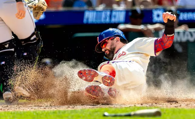Philadelphia Phillies designated hitter Kyle Schwarber scores on an RBI single hit by Brandon Marsh during the sixth inning of a baseball game against the Chicago White Sox, Sunday, June 7, 2026, in Philadelphia. (AP Photo/Laurence Kesterson)