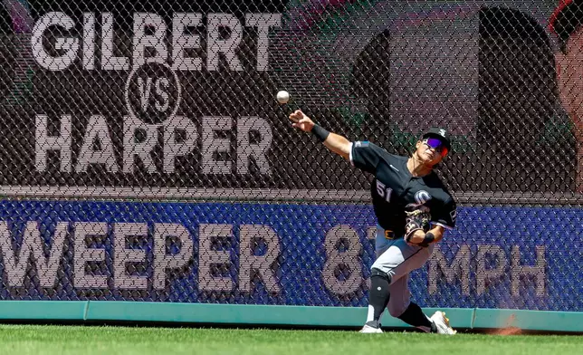 Chicago White Sox right fielder Rikuu Nishida throws to second base on a double hit by Philadelphia Phillies' Bryce Harper during the first inning of a baseball game, Sunday, June 7, 2026, in Philadelphia. (AP Photo/Laurence Kesterson)