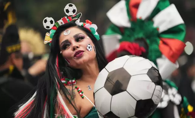A dancer performs along Reforma Avenue in Mexico City, Saturday, June 6, 2026 ahead of the FIFA World Cup. (AP Photo/Moises Castillo)