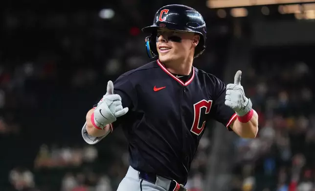 Cleveland Guardians' Travis Bazzana gestures while running the bases after hitting a home run during the first inning of a baseball game against the Texas Rangers, Friday, June 5, 2026, in Arlington, Texas. (AP Photo/LM Otero)