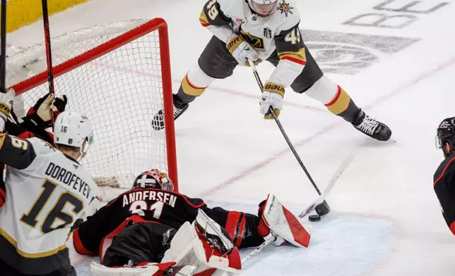 Carolina Hurricanes' Frederik Andersen (31) makes a save against Vegas Golden Knights' Ivan Barbashev (49) in the third period of Game 2 of the NHL hockey Stanley Cup Final series in Raleigh, N.C., Thursday, June 4, 2026. (AP Photo/Ben McKeown)