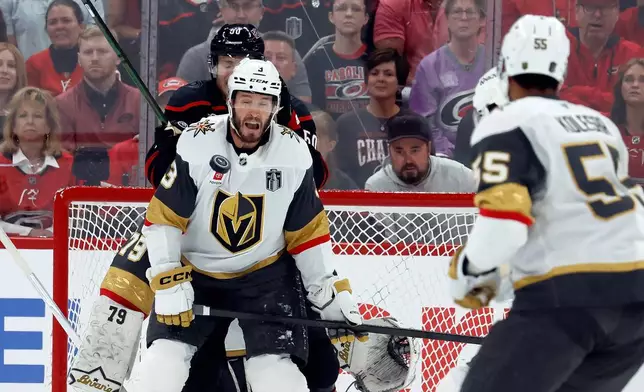 Vegas Golden Knights' Brayden McNabb takes a puck to the face during the first period in Game 2 of the NHL hockey Stanley Cup Final series against the Carolina Hurricanes in Raleigh, N.C., Thursday, June 4, 2026. (AP Photo/Karl DeBlaker)