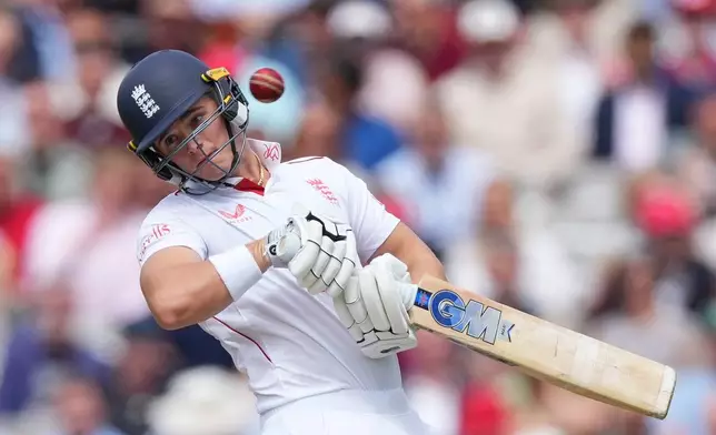 England's Jacob Bethell avoids a ball from New Zealand's Will O'Rourke during the second day of the test match between England and New Zealand at Lord's cricket ground in London, Friday, June 5, 2026. (AP Photo/Kirsty Wigglesworth)