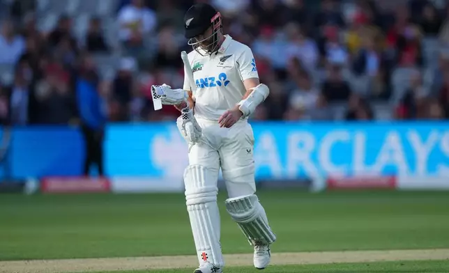 New Zealand's Kane Williamson leaves the pitch after losing his wicket during the second day of the test match between England and New Zealand at Lord's cricket ground in London, Friday, June 5, 2026. (AP Photo/Kirsty Wigglesworth)