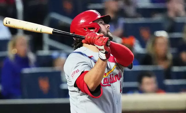 St. Louis Cardinals' Alec Burleson follows through on a two-run home run during the fifth inning of a baseball game against the New York Mets Tuesday, June 9, 2026, in New York. (AP Photo/Frank Franklin II)