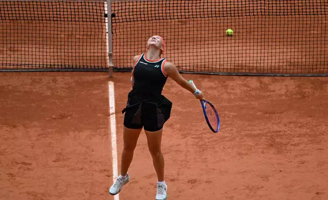 Russia's Diana Shnaider reacts after winning the quarterfinal tennis match against Aryna Sabalenka of Belarus at the French Open in Paris, Wednesday, June 3, 2026. (AP Photo/Emma Da Silva)