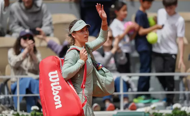Russia's Anna Kalinskaya walks off the court after the quarterfinal tennis match against Poland's Maja Chwalinska at the French Open in Paris, Wednesday, June 3, 2026. (AP Photo/Aurelien Morissard)