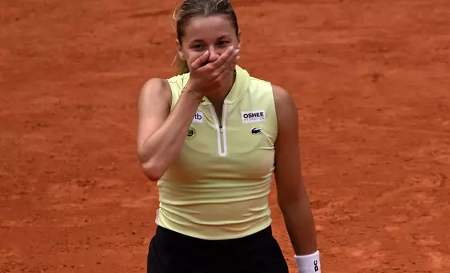 Poland's Maja Chwalinska reacts after winning the quarterfinal tennis match against Russia's Anna Kalinskaya at the French Open in Paris, Wednesday, June 3, 2026. (AP Photo/Emma Da Silva)