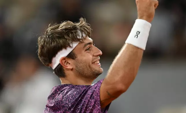 Italy's Flavio Cobolli reacts after winning the quarterfinal tennis match against Canada's Felix Auger-Aliassime at the French Open in Paris, Wednesday, June 3, 2026. (AP Photo/Emma Da Silva)