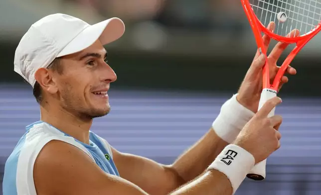 Italy's Matteo Arnaldi reacts during the quarterfinal tennis match against Italy's Matteo Berrettini at the French Open in Paris, Wednesday, June 3, 2026. (AP Photo/Christophe Ena)