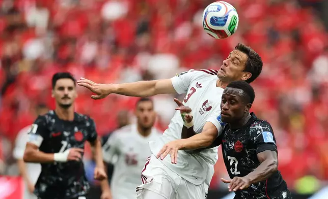 Qatar's Lucas Mendes (3) and Canada's Richie Laryea (22) battle for the ball during the World Cup Group B soccer match between Canada and Qatar in Vancouver, British Columbia, Thursday, June 18, 2026. (AP Photo/Emma Peterson)