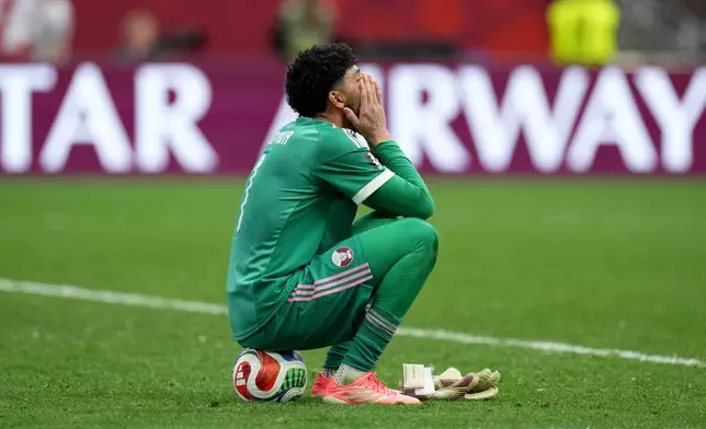 Qatar goalkeeper Mahmoud Abunada reacts after the World Cup Group B soccer match between Canada and Qatar in Vancouver, British Columbia, Thursday, June 18, 2026. (Ethan Cairns/The Canadian Press via AP)