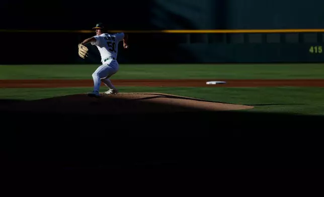 Athletics starting pitcher Jack Perkins throws during the first inning of a baseball game against the Milwaukee Brewers, Wednesday, June 10, 2026, in Las Vegas. (AP Photo/Caroline Brehman)