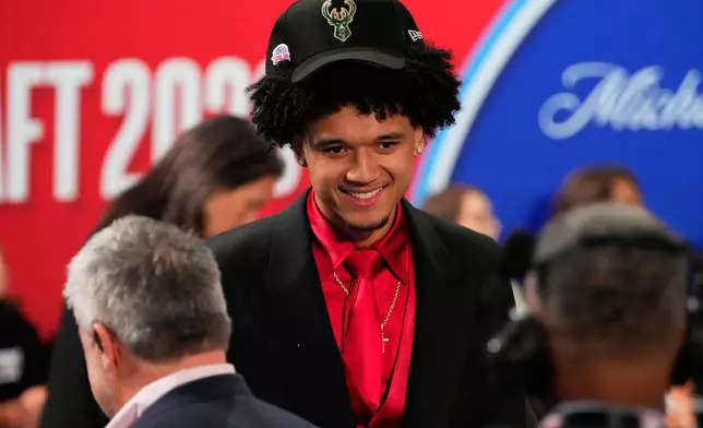 Brayden Burries is interviewed after being selected by the Milwaukee Bucks as the tenth overall pick in the first round of the NBA basketball draft, Tuesday, June 23, 2026, in New York. (AP Photo/Yuki Iwamura)