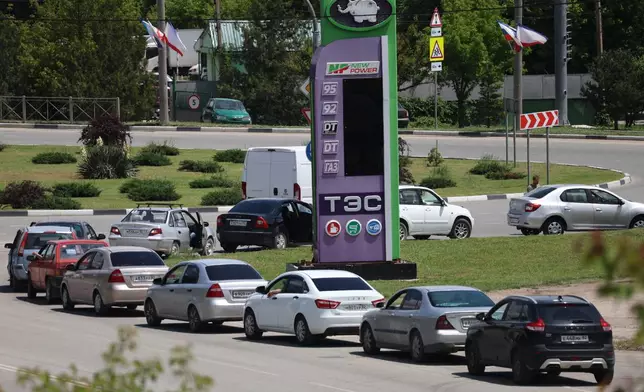 Cars line up at a petrol station in Simferopol, Crimea, Friday, June 12, 2026. (AP Photo)