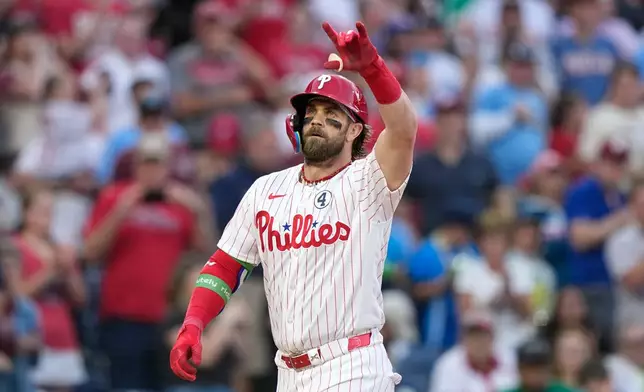 Philadelphia Phillies' Bryce Harper reacts after hitting a two-run home run against San Diego Padres pitcher Randy Vásquez during the fourth inning of a baseball game Tuesday, June 2, 2026, in Philadelphia. (AP Photo/Matt Slocum)