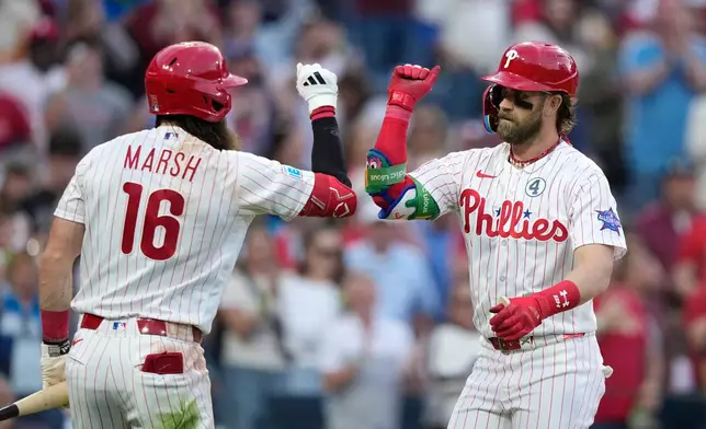 Philadelphia Phillies' Bryce Harper, right, and Brandon Marsh celebrate after Harper's two-run home run against San Diego Padres pitcher Randy Vásquez during the fourth inning of a baseball game Tuesday, June 2, 2026, in Philadelphia. (AP Photo/Matt Slocum)