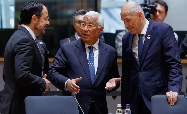 From left, Cypriot President Nikos Christodoulides, European Council President Antonio Costa and Slovenia's Prime Minister Janez Jansa talk during a round table meeting at the EU summit in Brussels, Friday, June 19, 2026. (AP Photo/Geert Vanden Wijngaert)