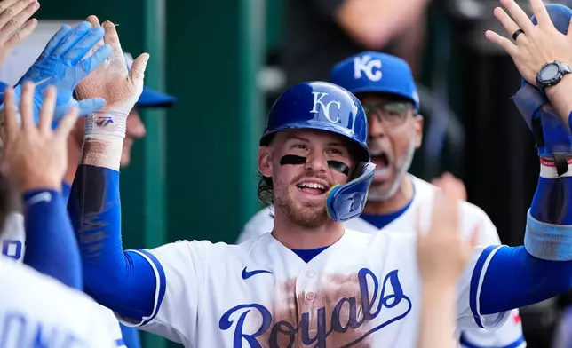 Kansas City Royals' Bobby Witt Jr. celebrates in the dugout after scoring on a double by Starling Marte during the second inning of a baseball game against the St. Louis Cardinals, Thursday, June 18, 2026, in Kansas City, Mo. (AP Photo/Charlie Riedel)