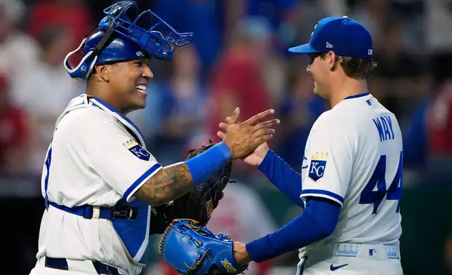 Kansas City Royals catcher Salvador Perez, left, and pitcher Beck Way (44) celebrate after their baseball game against the St. Louis Cardinals, Thursday, June 18, 2026, in Kansas City, Mo. (AP Photo/Charlie Riedel)