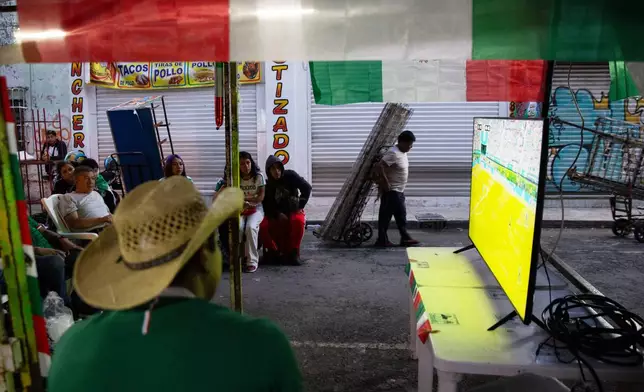 Mexico soccer fans watch a World Cup match between Mexico and South Korea in the Tepito neighborhood of Mexico City, Thursday, June 18, 2026. (AP Photo/Megan Janetsky)