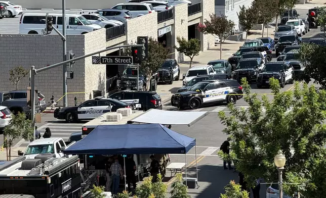 An overhead view shows the scene of a standoff after a man barricaded himself inside a bank on Tuesday, June 2, 2026, in Bakersfield, Calif. (Jacob, Dad’s Gone Live via AP)
