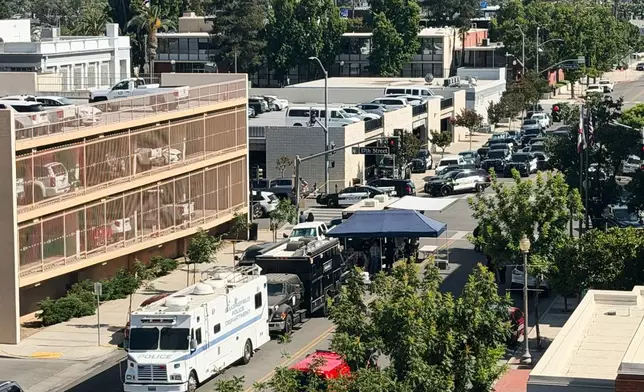 An overhead view shows the scene of a standoff after a man barricaded himself inside a bank on Tuesday, June 2, 2026 in Bakersfield, Calif. (Jacob, Dad’s Gone Live via AP)