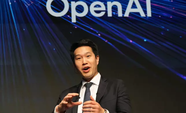 Mark Chen, chief research officer for OpenAI, speaks during a talk with Masayoshi Son, chairman and CEO of SoftBank Group, at their business event at a hotel in Tokyo, Tuesday, June 16, 2026. (AP Photo/Hiro Komae)