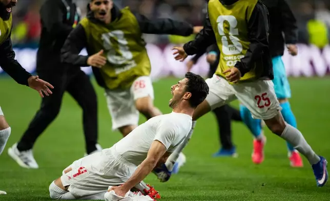 Iran's Shoja Khalilzadeh (4) celebrates after scoring a goal before it was overturned following a VAR review during the World Cup Group G soccer match between Egypt and Iran in Seattle, Friday, June 26, 2026. (AP Photo/Lindsey Wasson)