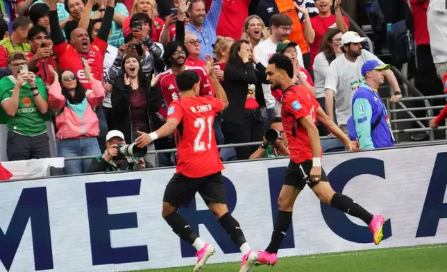 Egypt's Mahmoud Saber (21) celebrates after scoring before the World Cup Group G soccer match between Egypt and Iran in Seattle, Friday, June 26, 2026. (AP Photo/Ted S. Warren)